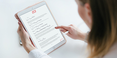 Woman reading whitepaper on RadCalc on a tablet